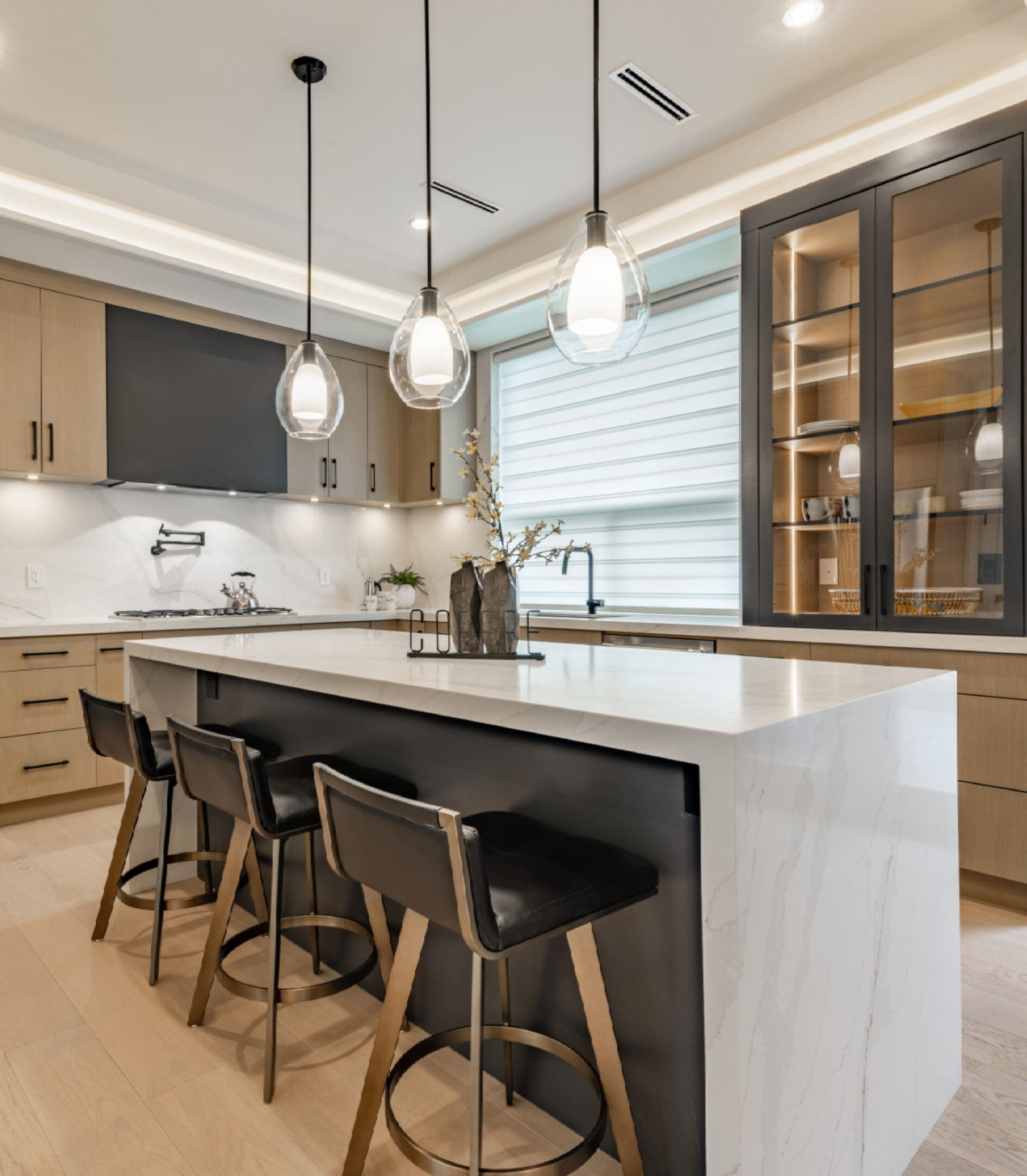 Contemporary kitchen featuring marble island