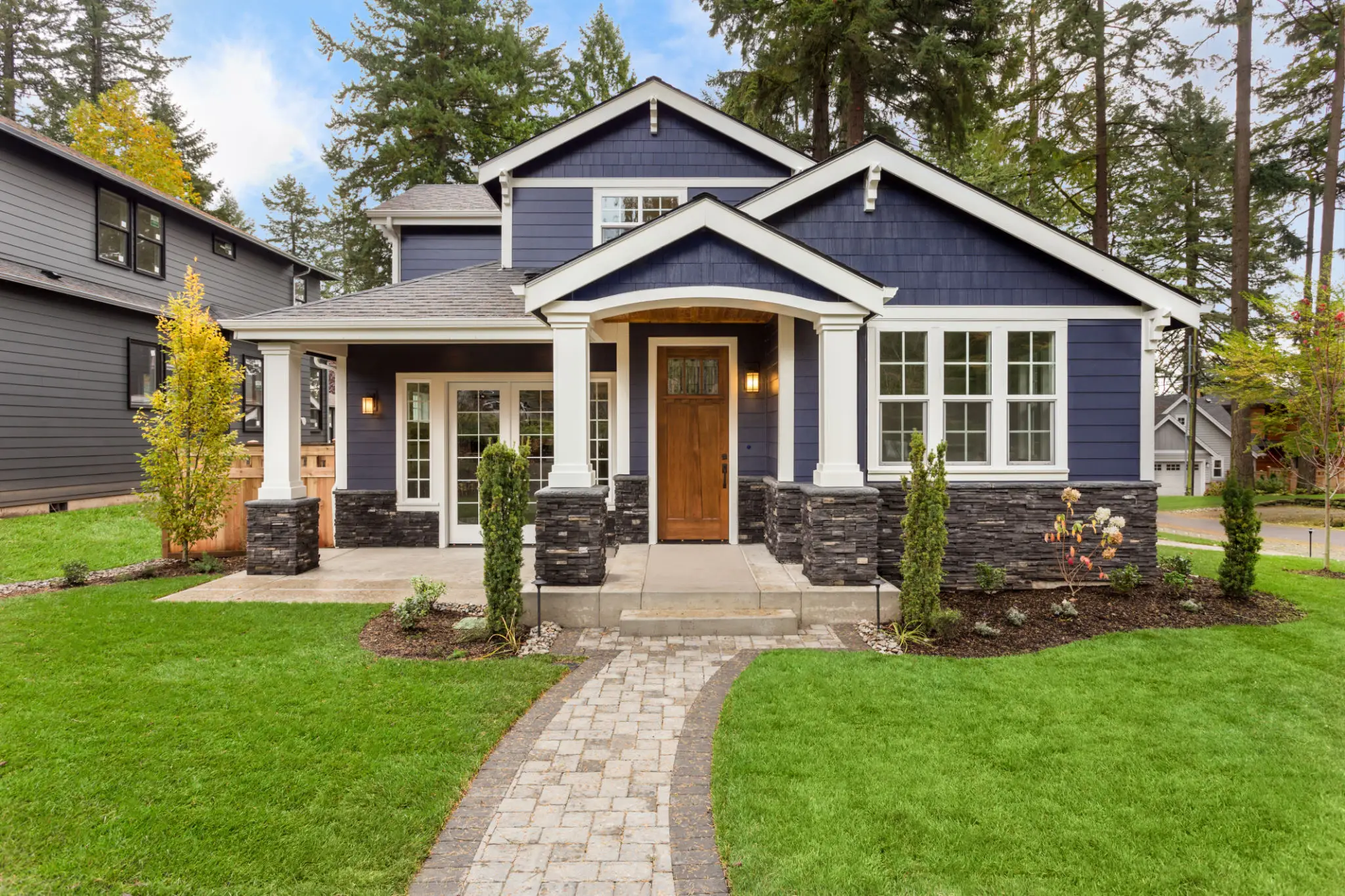 Blue craftsman house with front porch