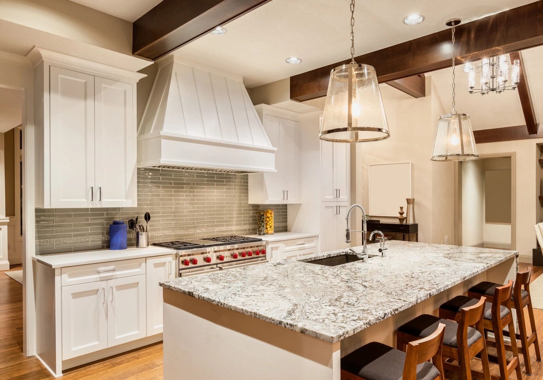 Modern kitchen with granite island and pendant lights